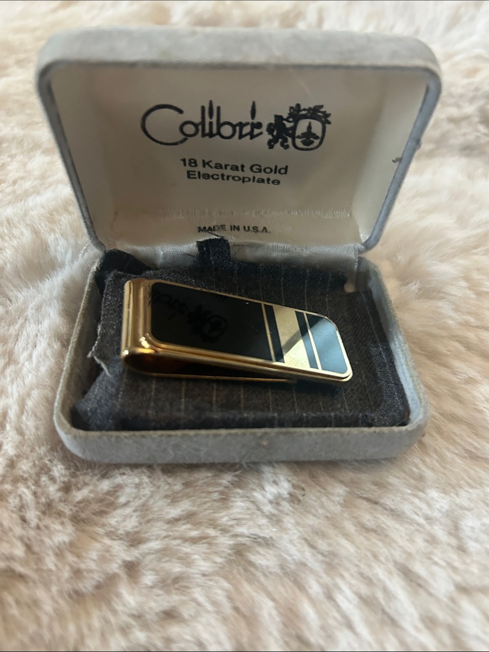 Colibri 18k gold electroplated money clip in black and gold